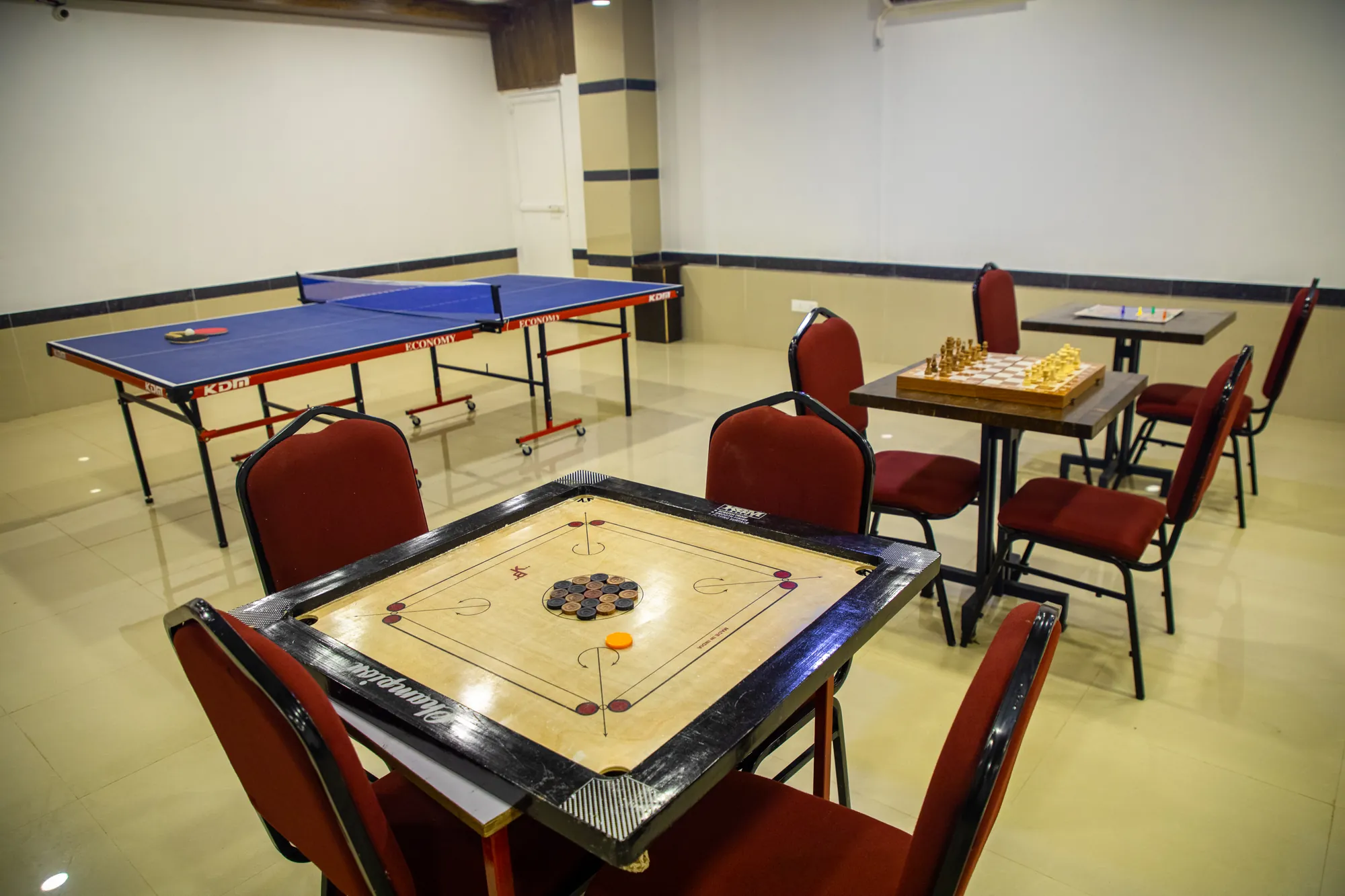 Carrom board in front of the table tennis table