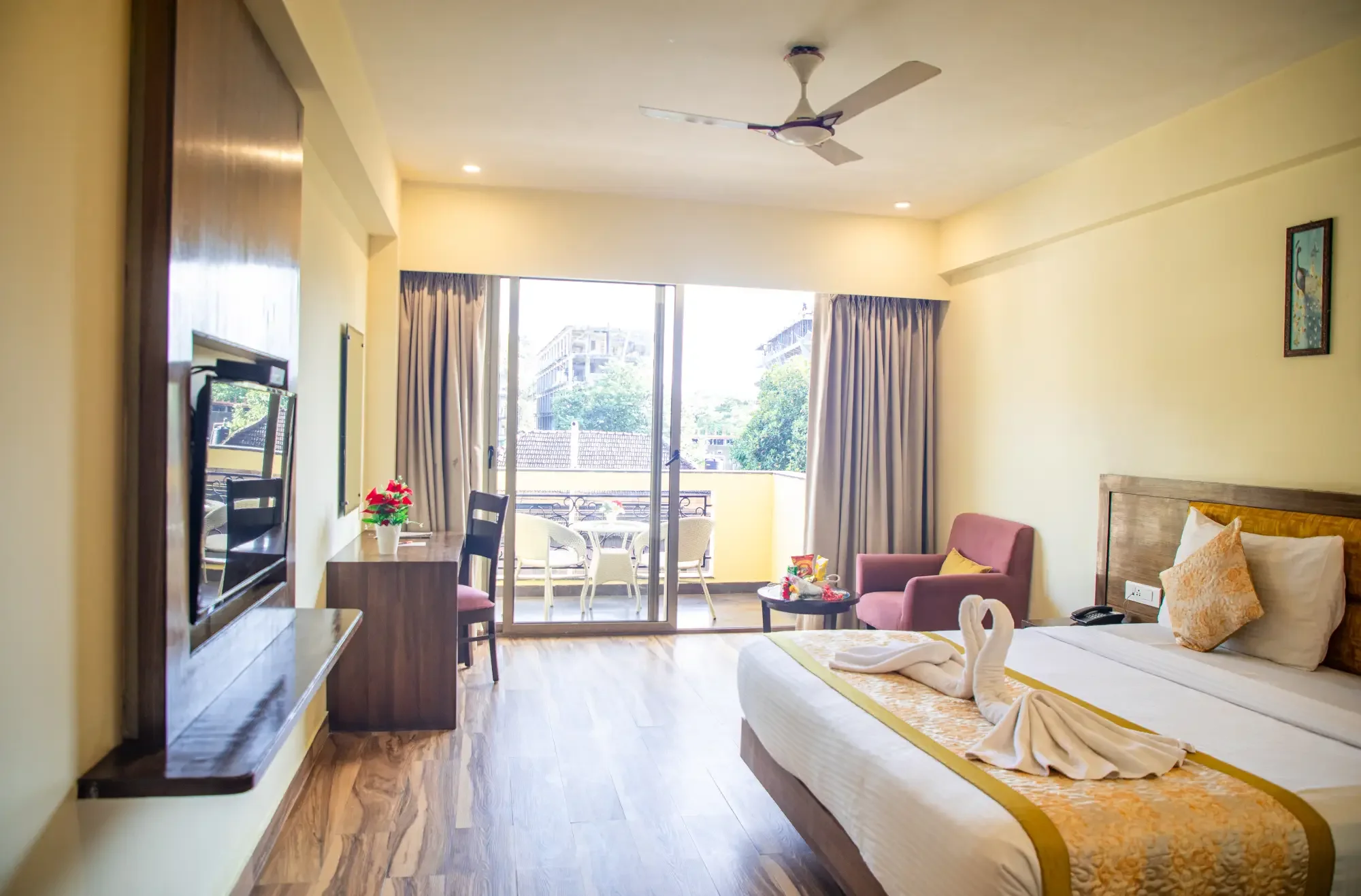 Deluxe room interior with balcony doors open