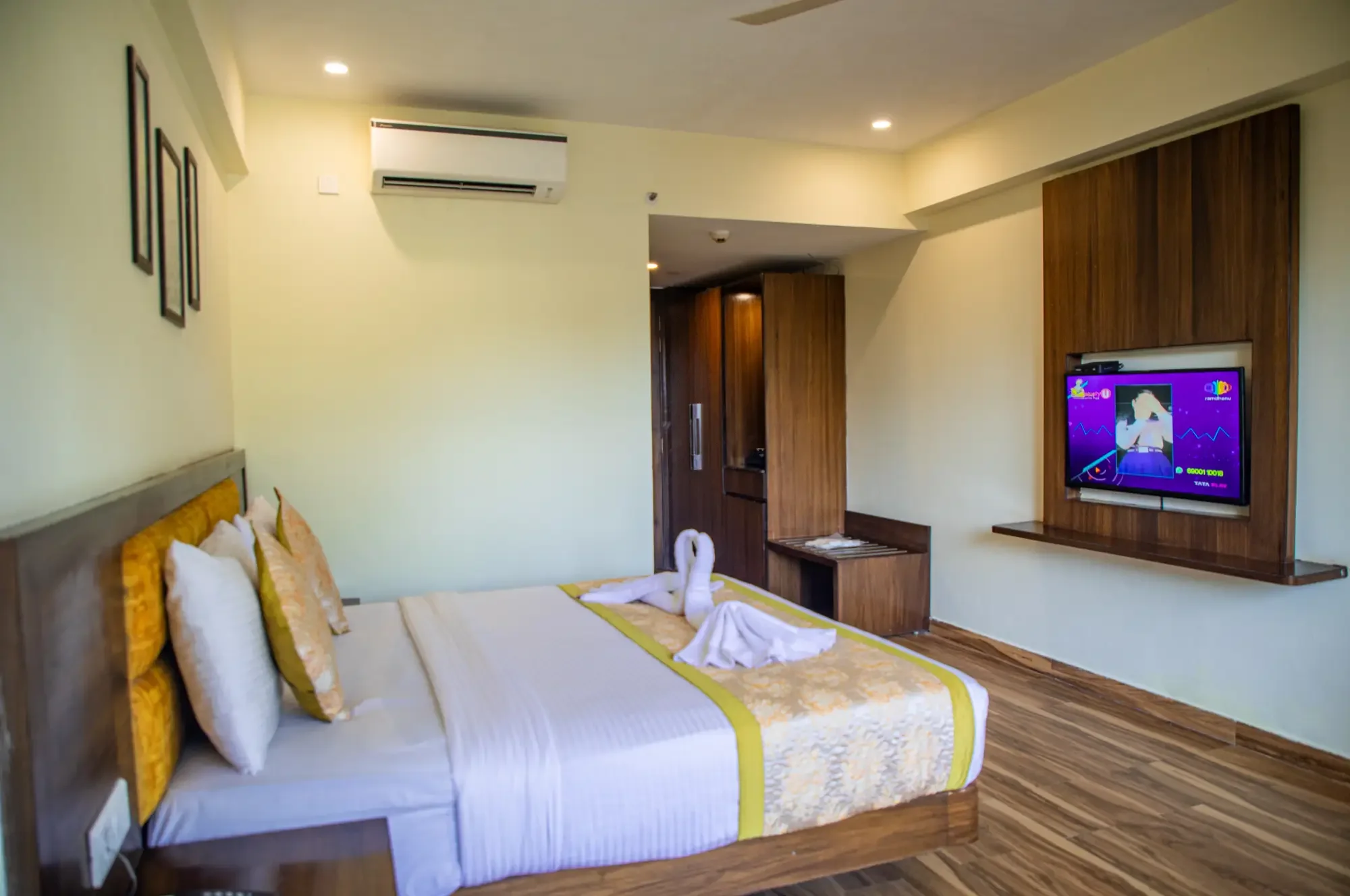 Deluxe Pool View bed with wall-mounted television