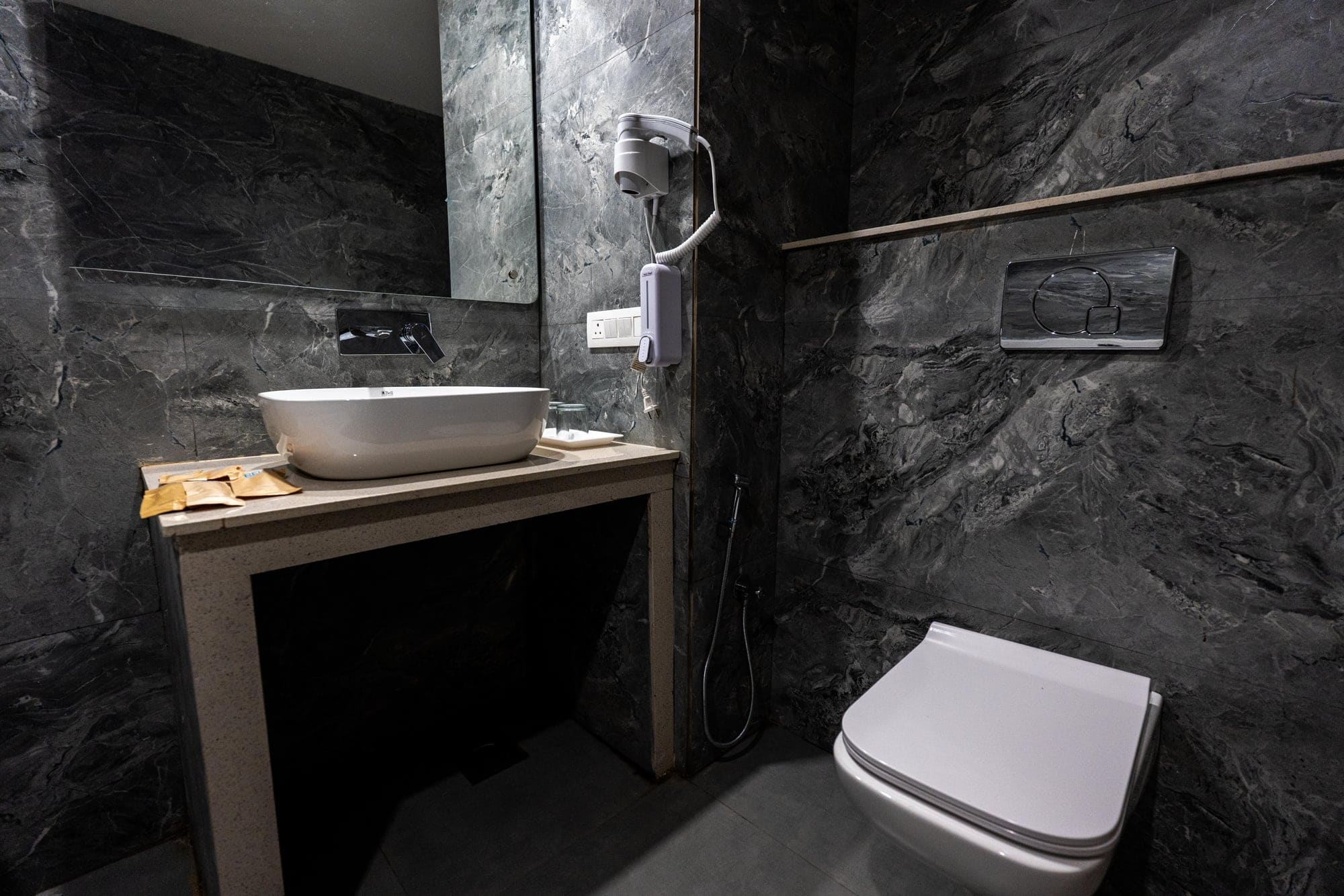 Deluxe Pool View bathroom in dark marble