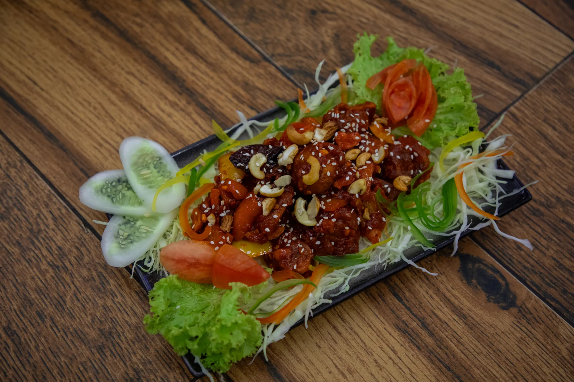 Crispy starter tossed with cashews, garnished with salad