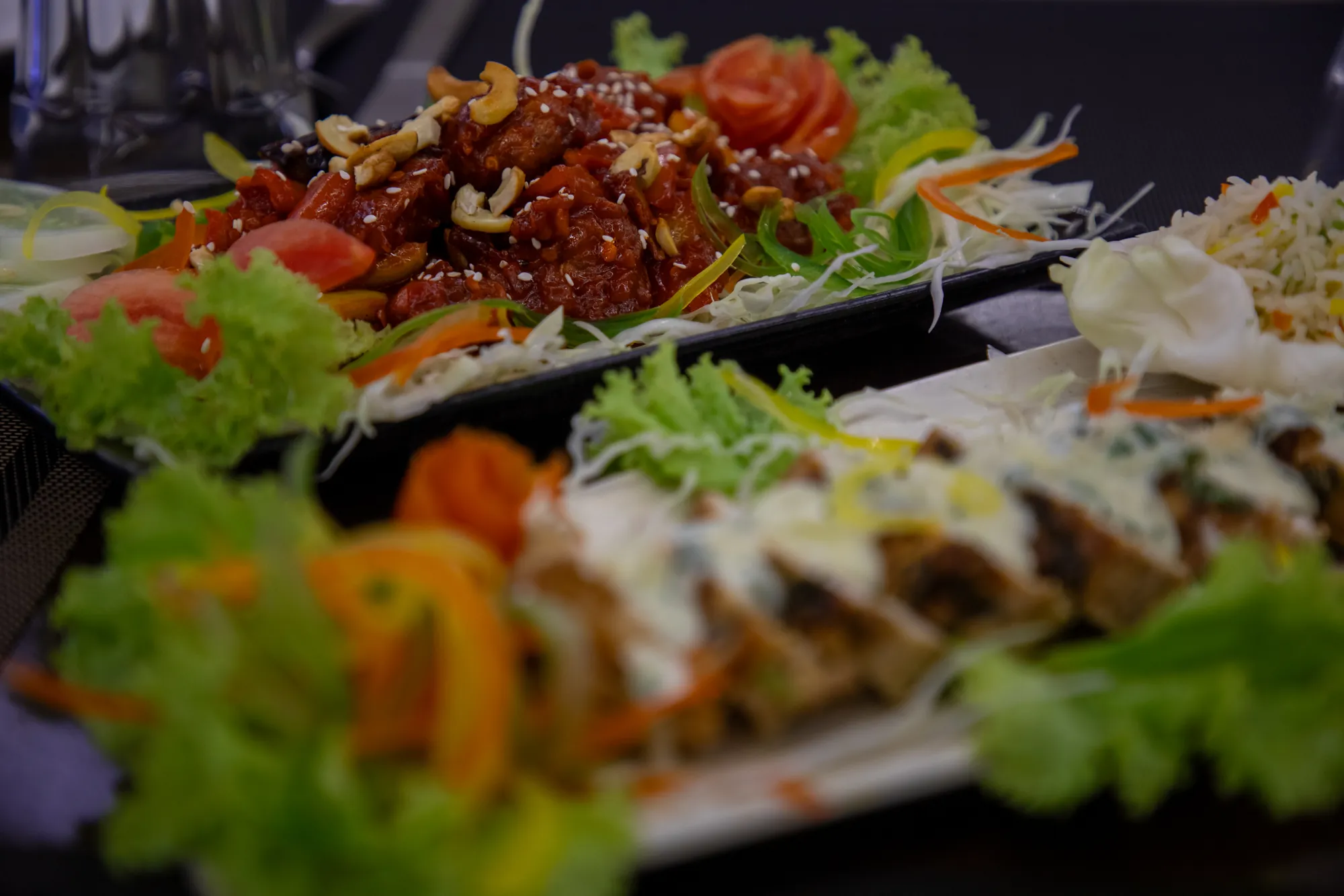 Close-up of starters garnished with fresh salad