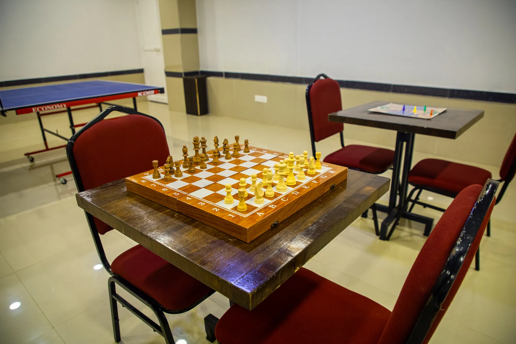 Chess table with a table tennis table behind