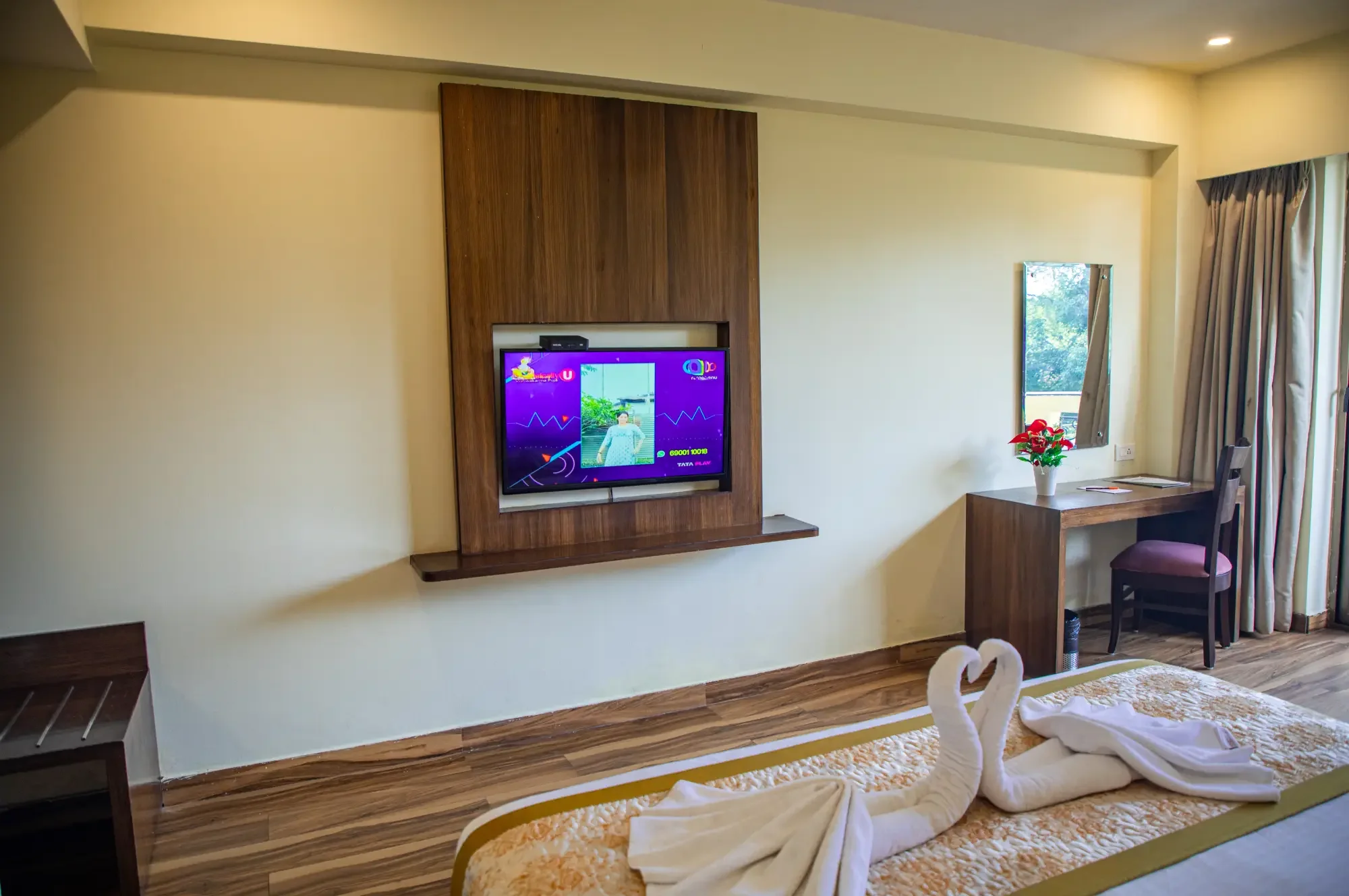 Deluxe City View bedroom with king bed, TV and desk