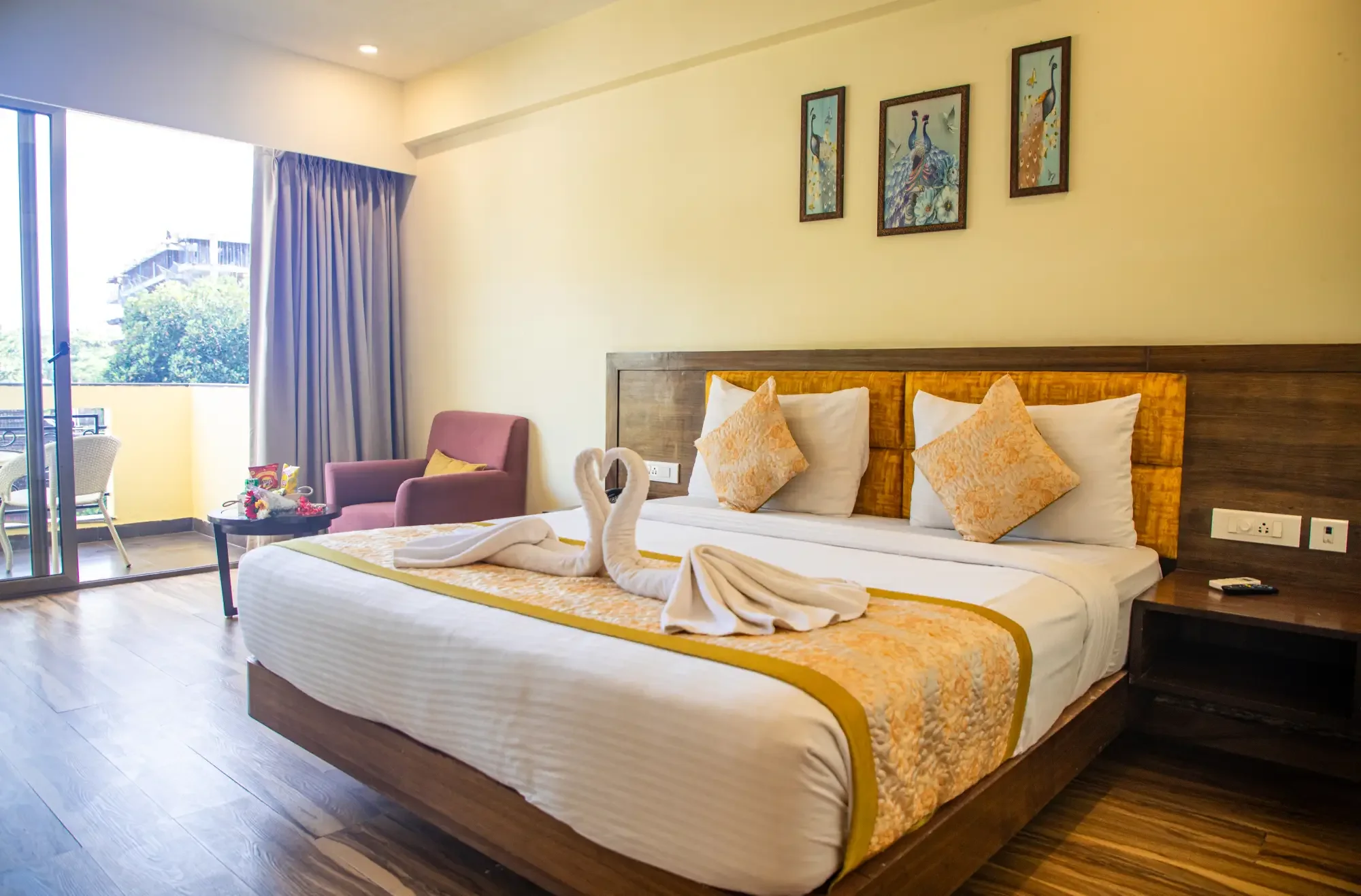 Deluxe Pool View bedroom with king bed and balcony