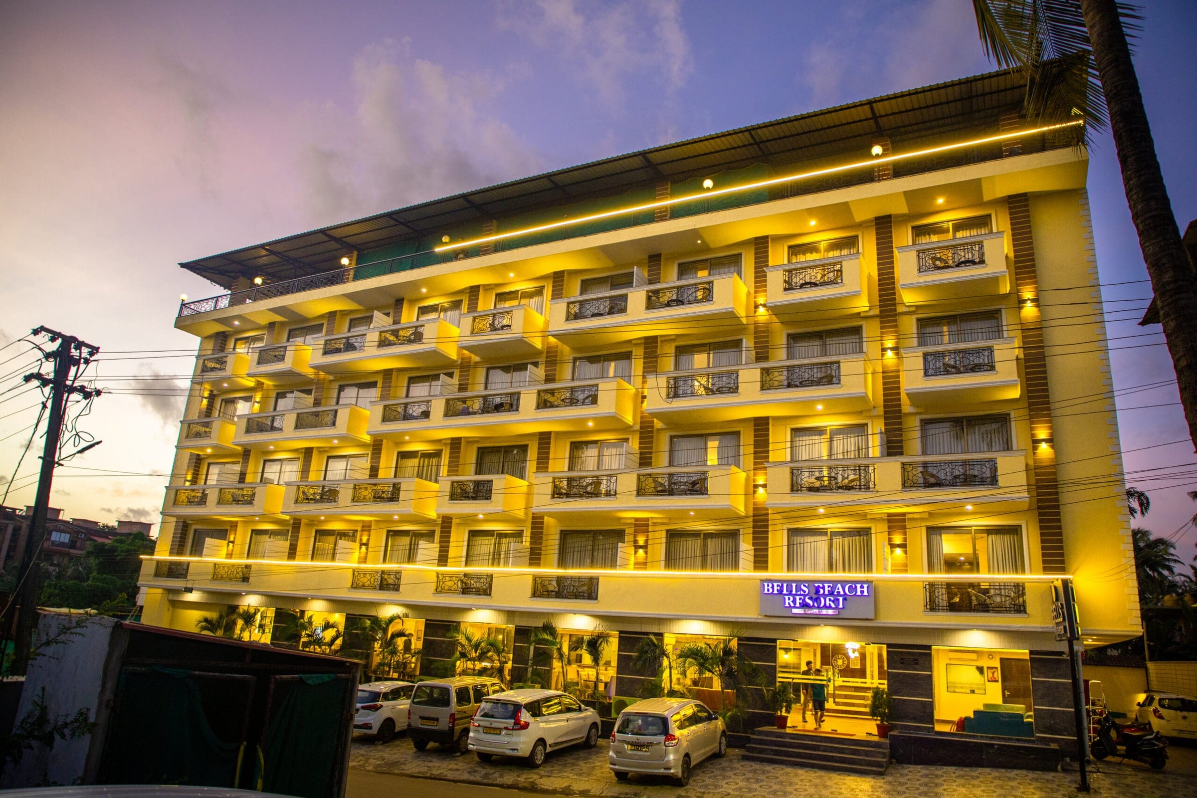 Bells Beach Resort building lit up at dusk